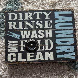Decorative Laundry Sign with Black and Blue Text